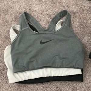 3 nike pro sports bras black white and grey